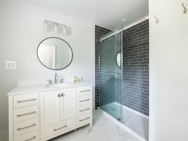 bathroom featuring vanity and a shower with door