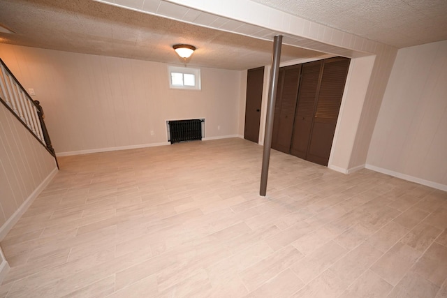 basement featuring wood walls