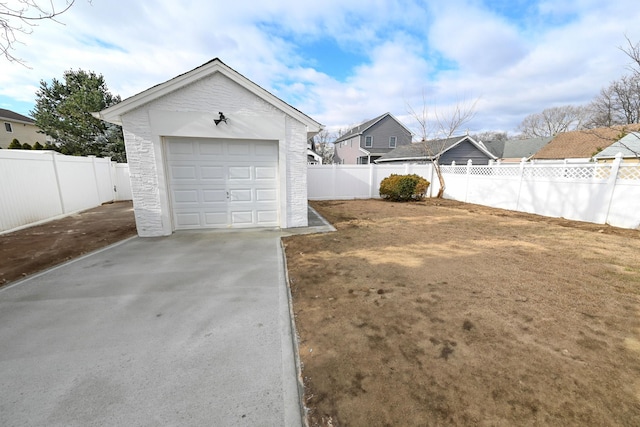 exterior space featuring a garage and an outbuilding