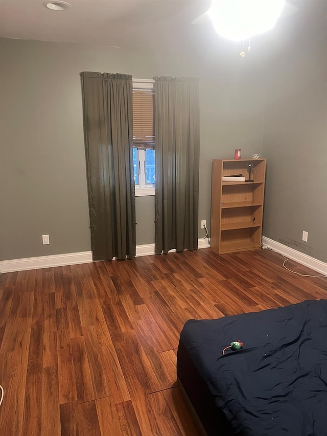 unfurnished bedroom with hardwood / wood-style floors