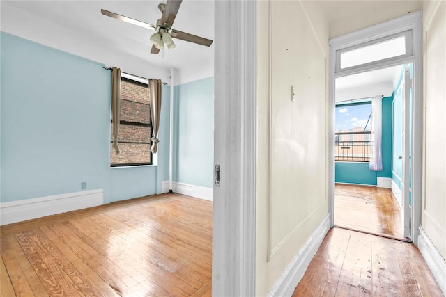 interior space featuring hardwood / wood-style floors and ceiling fan