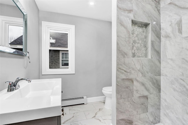 bathroom with vanity, toilet, a shower, and a baseboard radiator