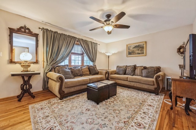 living room with ceiling fan and wood-type flooring