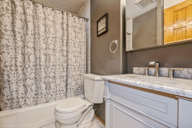 bathroom featuring tile patterned floors, vanity, and toilet