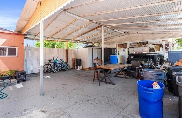 view of patio with a storage unit