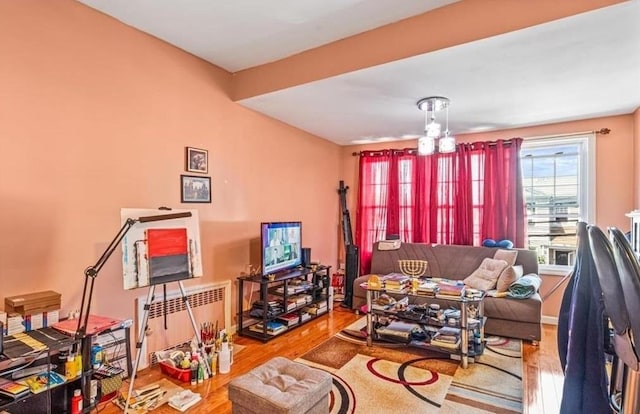 living room with radiator and light hardwood / wood-style floors