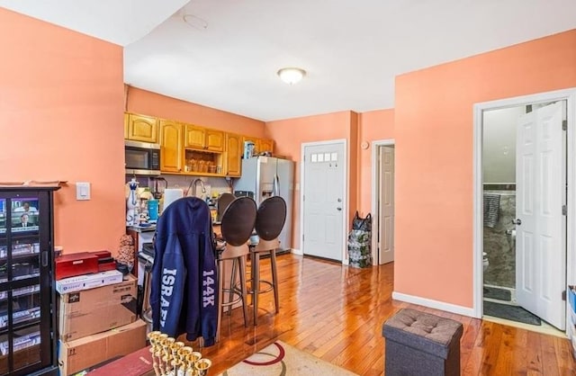 kitchen featuring hardwood / wood-style floors and stainless steel appliances