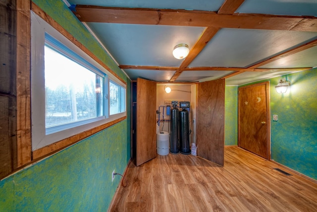 interior space with coffered ceiling and light wood-type flooring