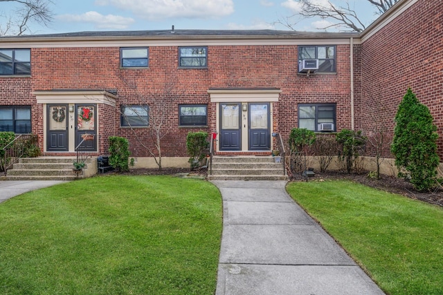 townhome / multi-family property featuring french doors and a front lawn