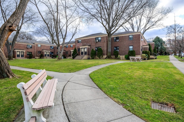 view of home's community featuring a lawn