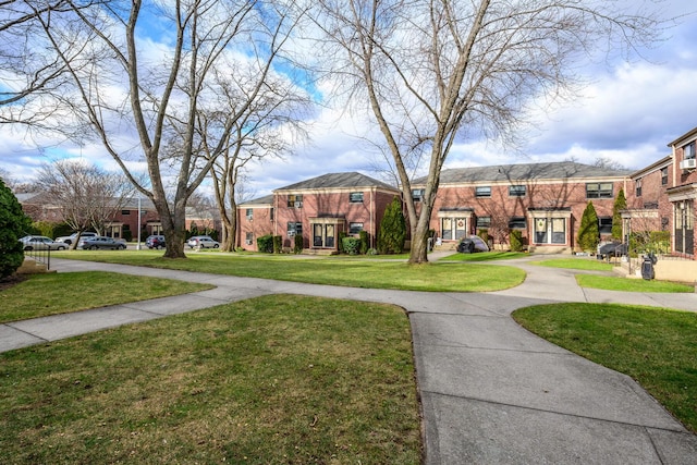 view of property's community with a yard