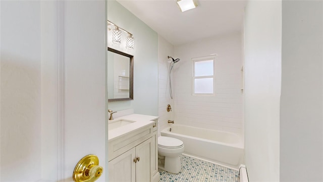 full bathroom featuring tile patterned floors, toilet, tiled shower / bath, a baseboard radiator, and vanity