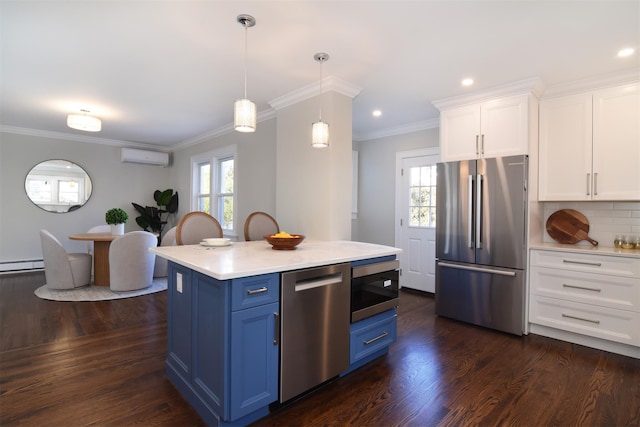 kitchen featuring blue cabinetry, white cabinets, stainless steel appliances, and hanging light fixtures