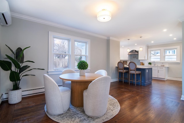 dining room with dark wood-type flooring, a baseboard heating unit, sink, ornamental molding, and a wall mounted AC