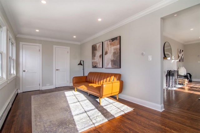 living area with crown molding, dark hardwood / wood-style floors, and a baseboard heating unit