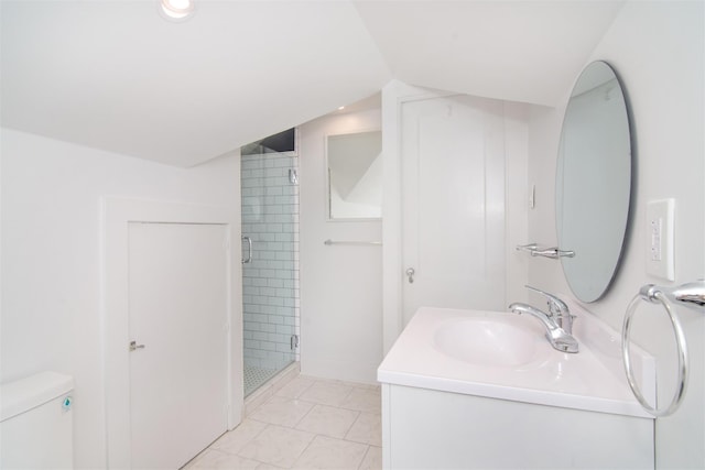 bathroom featuring tile patterned floors, an enclosed shower, vaulted ceiling, toilet, and vanity