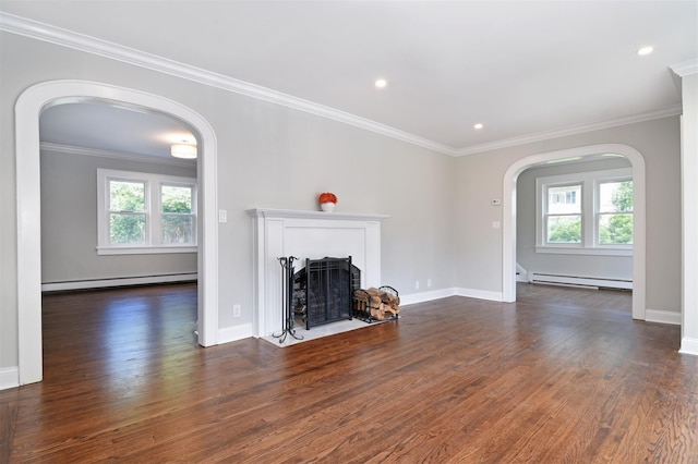 unfurnished living room featuring baseboard heating, dark wood-type flooring, and ornamental molding