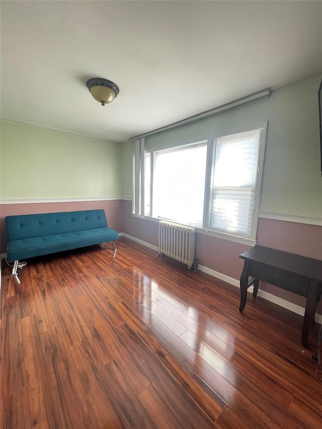 interior space featuring dark wood-type flooring and radiator