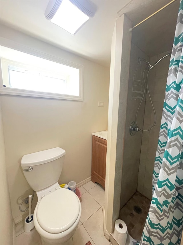 bathroom with curtained shower, a wealth of natural light, tile patterned flooring, and vanity