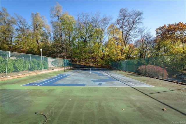 view of sport court featuring basketball hoop