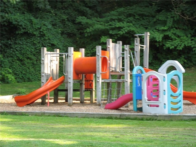 view of jungle gym featuring a lawn