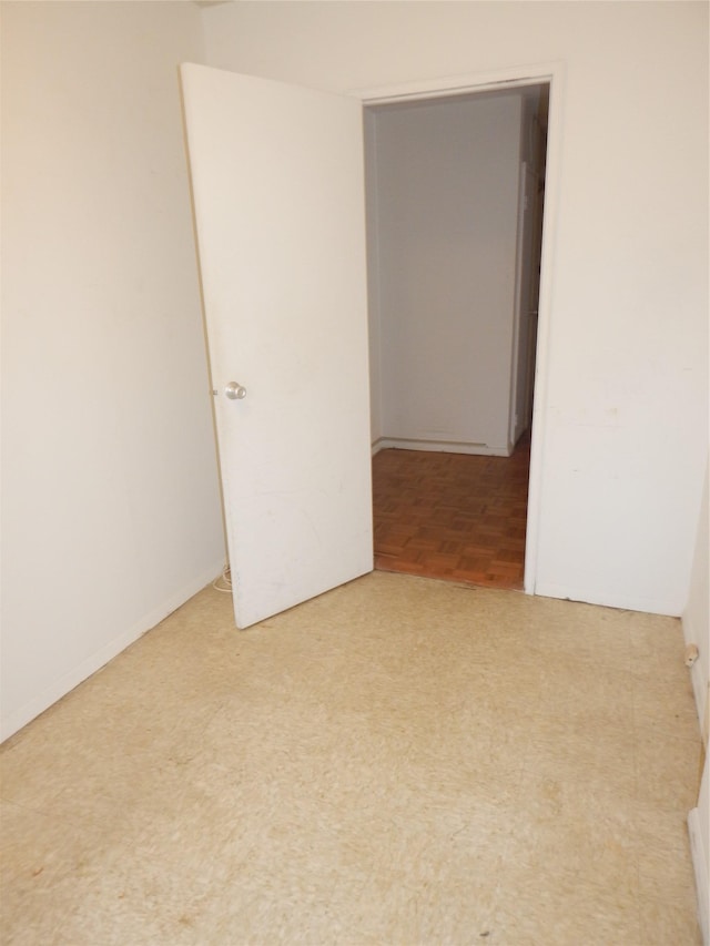 empty room with parquet flooring