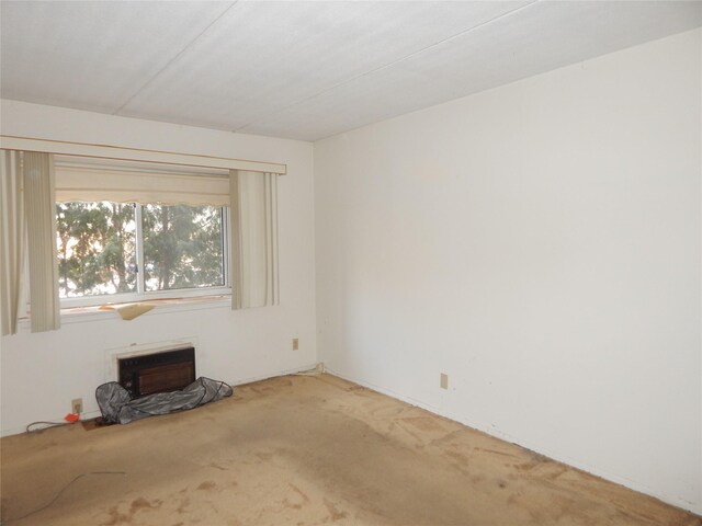 unfurnished living room featuring carpet flooring