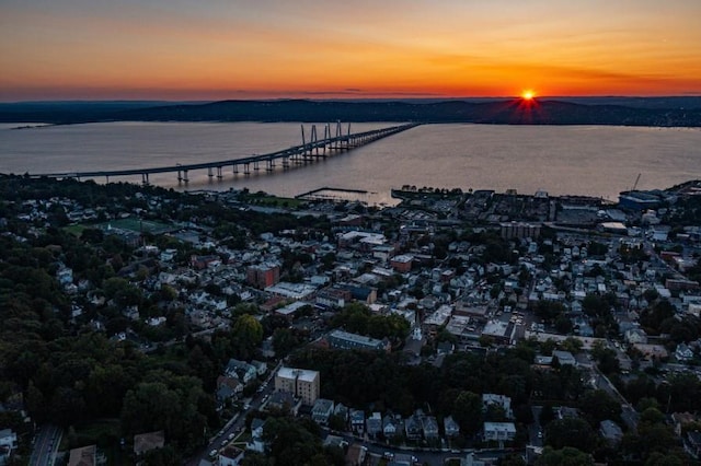 aerial view at dusk with a water view