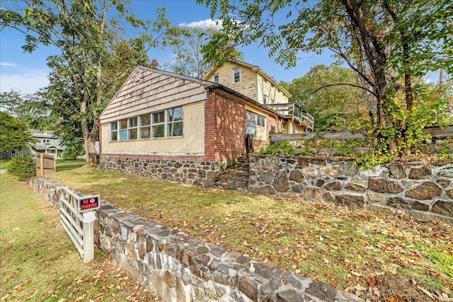 view of home's exterior featuring a lawn