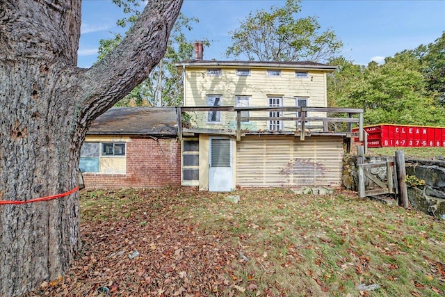 rear view of house with a wooden deck