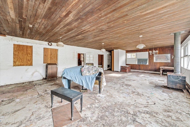 unfurnished dining area with wood ceiling