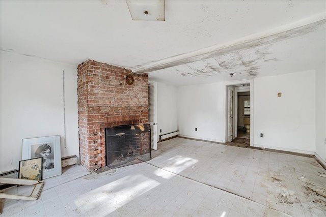 unfurnished living room with beam ceiling, a brick fireplace, and baseboard heating