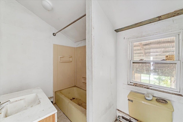 full bathroom with vanity, toilet, shower / bath combination, and vaulted ceiling