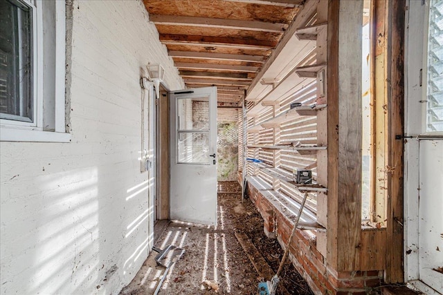 miscellaneous room featuring beam ceiling