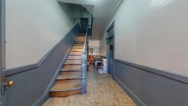 staircase with ornamental molding