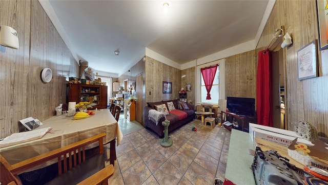 tiled living room with wood walls