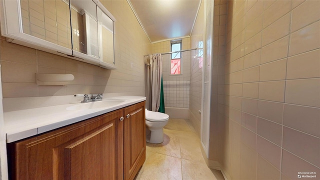 full bathroom featuring tile patterned flooring, vanity, toilet, and shower / bathtub combination with curtain