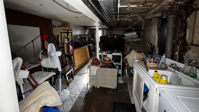 basement with washing machine and clothes dryer