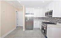 kitchen with appliances with stainless steel finishes and white cabinetry