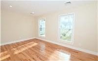 spare room with hardwood / wood-style floors