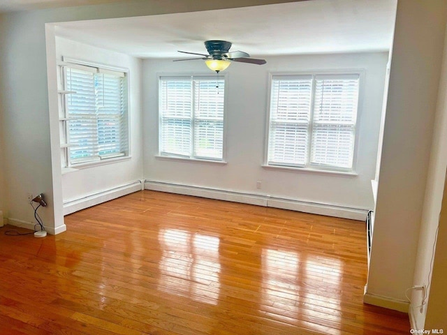 spare room featuring ceiling fan, plenty of natural light, and light hardwood / wood-style floors