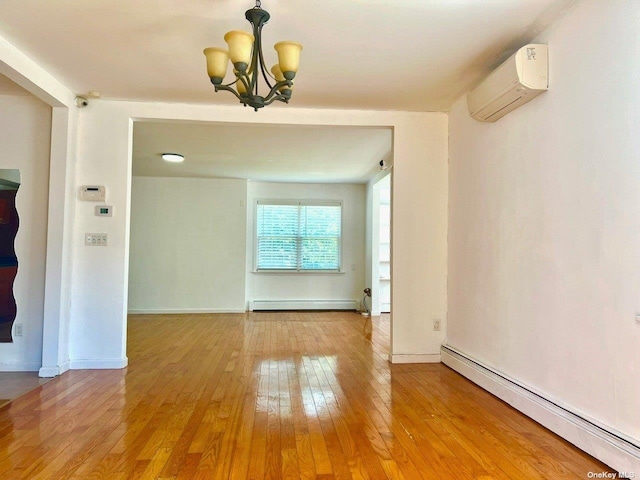 unfurnished dining area with wood-type flooring, an inviting chandelier, an AC wall unit, and a baseboard heating unit