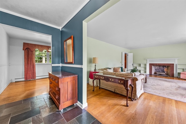 17 Walnut Hill Rd, Poughkeepsie, NY 12603 - living area featuring a fireplace, dark wood-style floors, baseboard heating, and ornamental molding