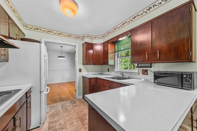 17 Walnut Hill Rd, Poughkeepsie, NY 12603 - kitchen with black microwave, light countertops, a peninsula, and stainless steel electric cooktop