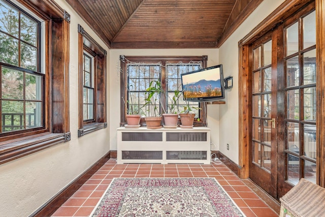 unfurnished sunroom with french doors, wood ceiling, and vaulted ceiling