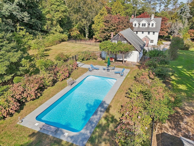 view of pool featuring a patio and a lawn