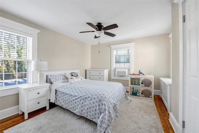 bedroom with hardwood / wood-style floors and ceiling fan