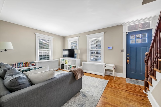 living room with radiator and hardwood / wood-style floors