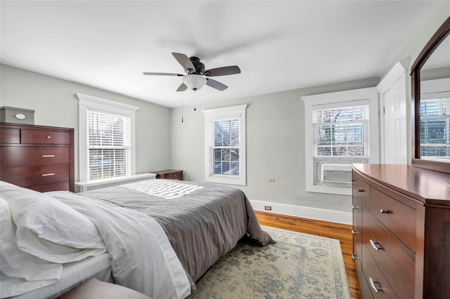 bedroom featuring ceiling fan and light hardwood / wood-style flooring