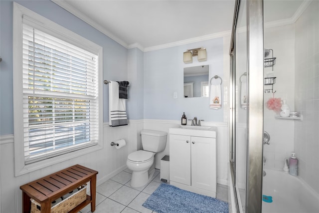 full bathroom featuring vanity, shower / bath combination with glass door, tile patterned floors, toilet, and ornamental molding